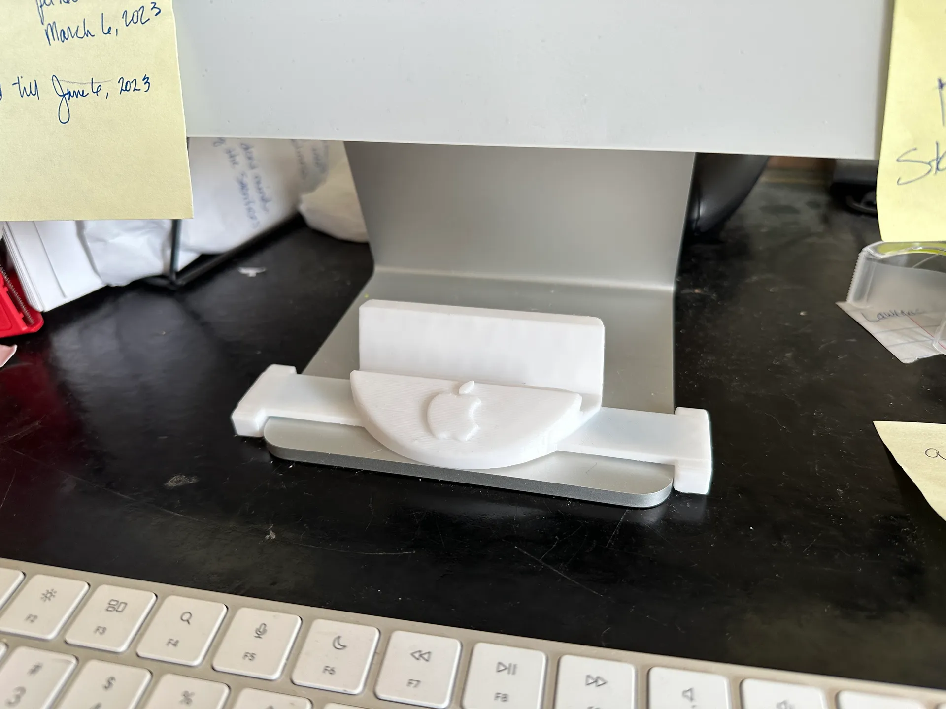 iPhone Stand works with Case to mount under iMac on the base