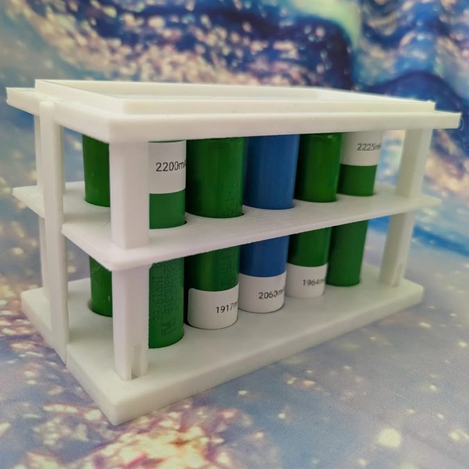 Stackable 18650 cells container with inspection holes