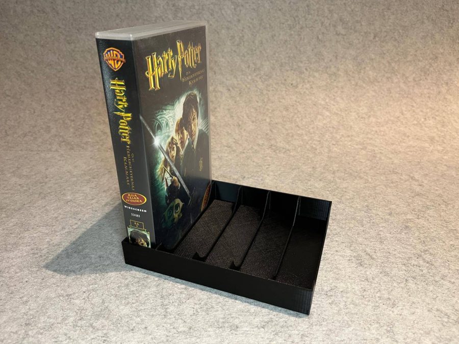 Stand holder for VHS cassettes