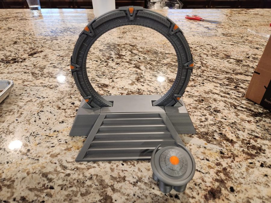 Stargate in an off-world pedestal with a DHD