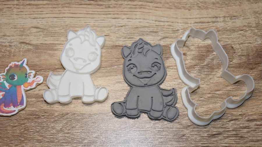 cookie cutter unicorn smiling sitting