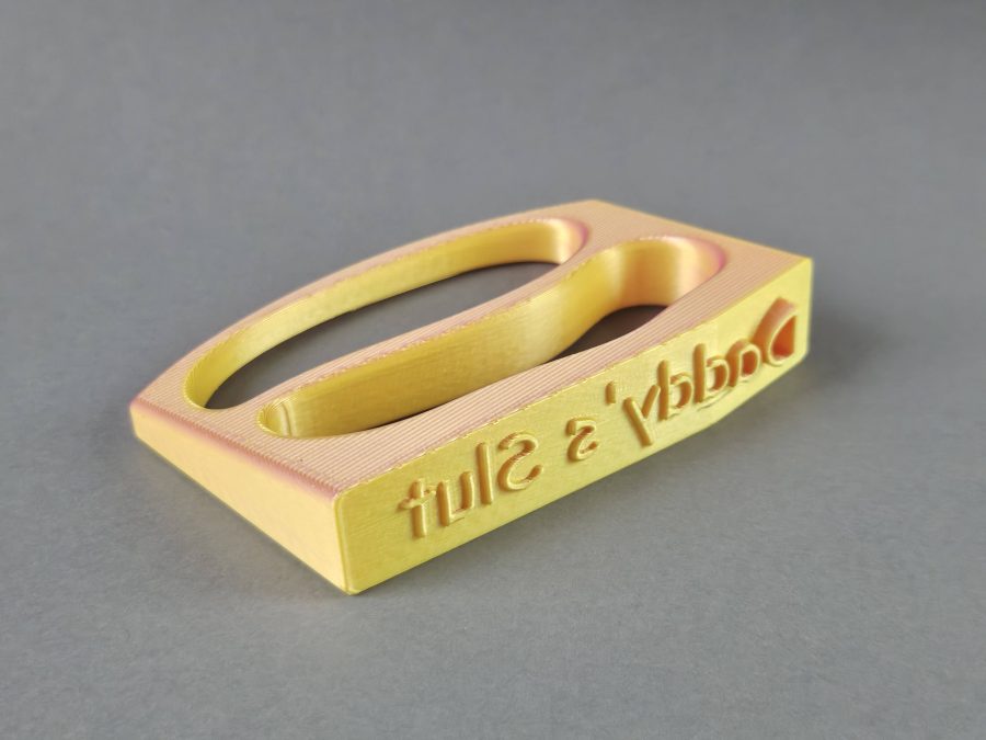 Brass knuckles with costume writing
