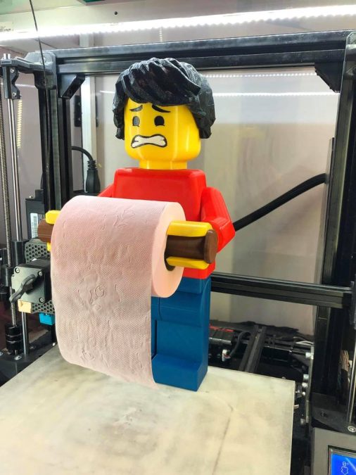Scared face brick man toilet roll holder