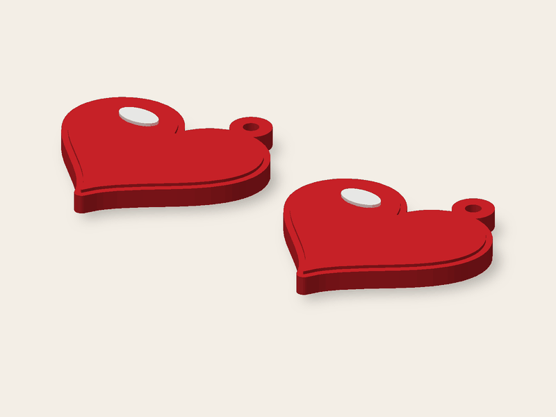 Un par de corazones rojos, cada uno de 28 mm de ancho.