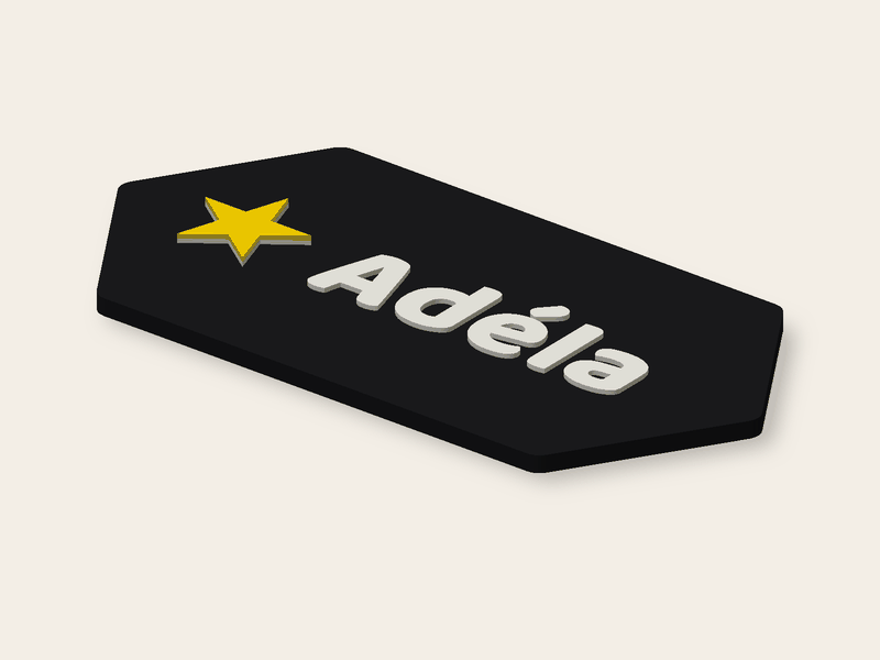 Hexágono de 120 × 60 mm con el nombre Adéla y una estrella, tres colores.