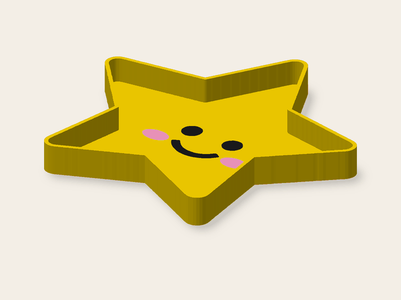 Bandejita con forma de estrella de 120 mm con una cara incrustada en el fondo en colores.