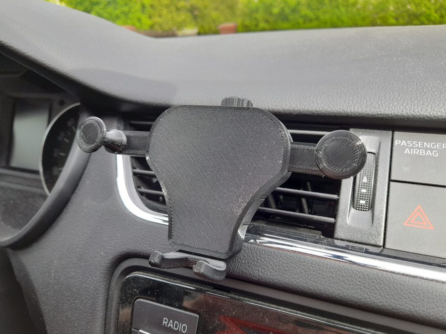 Gravity car phone holder / better clip